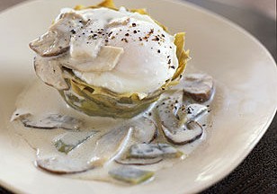 Poached Eggs on Artichoke Bottoms with White Truffle Cream and Mushrooms