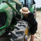 Susan inspects the tractor